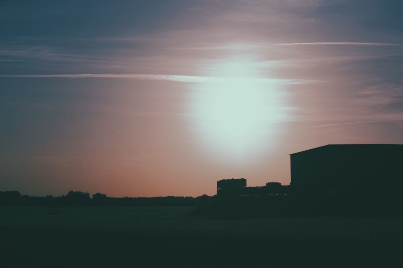 Silhouette of building at sunset