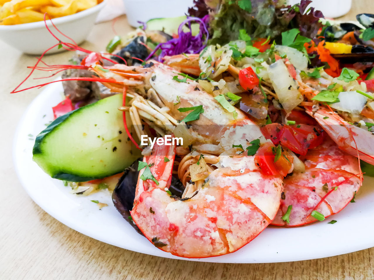 High angle view of prawns with salad served in plate