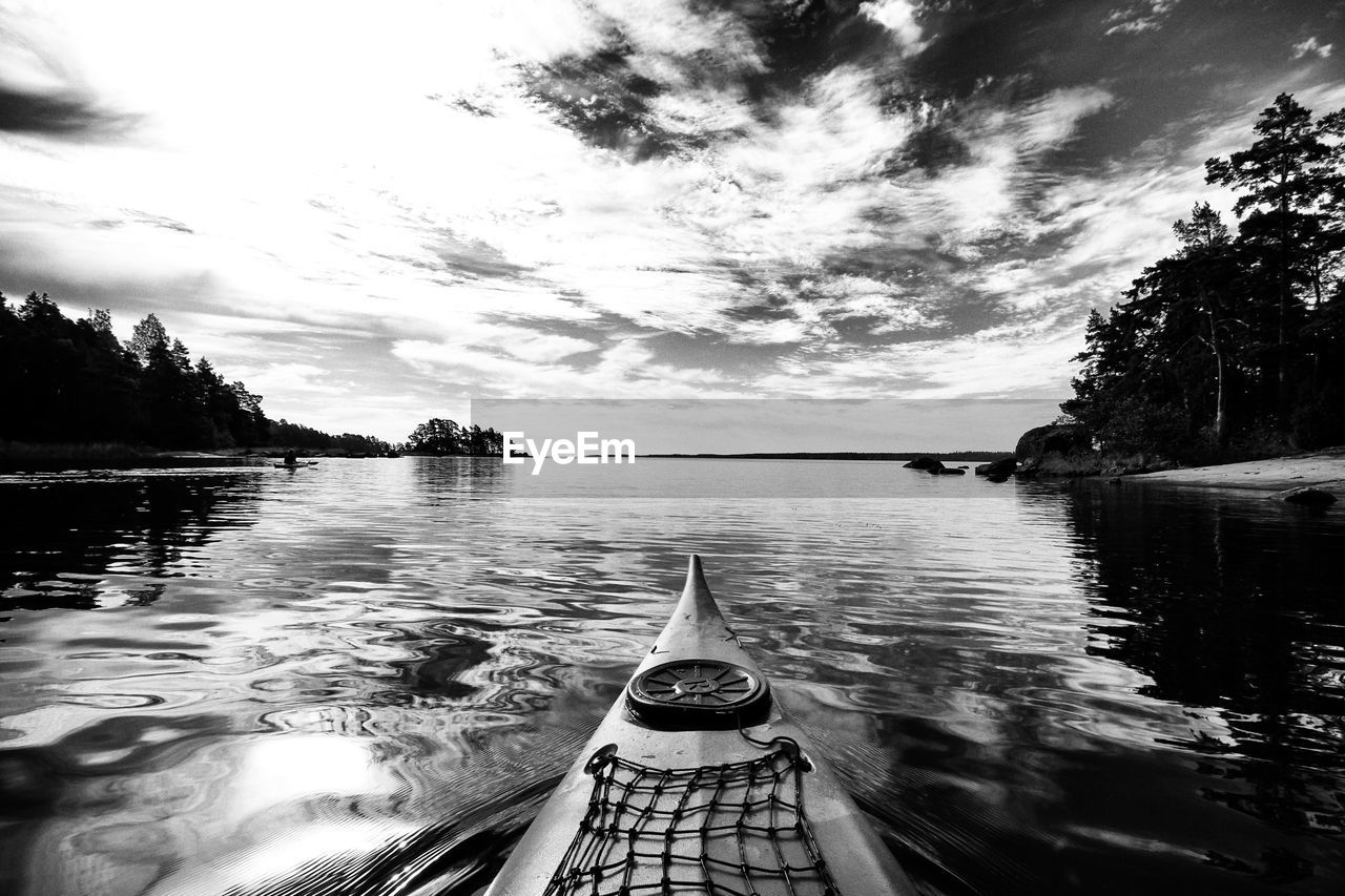 Close-up of cropped canoe in calm river