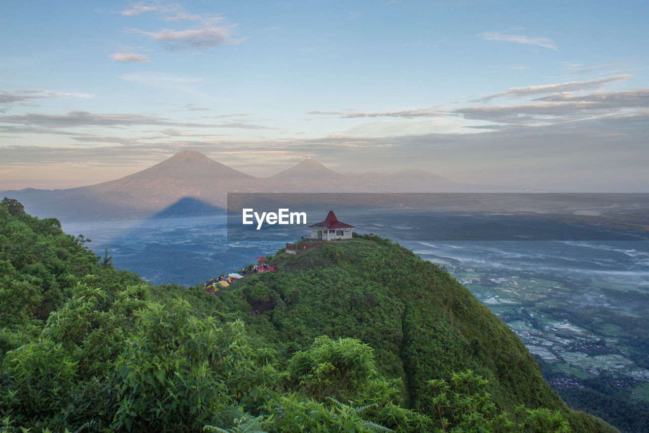 Scenic view of mountain against cloudy sky