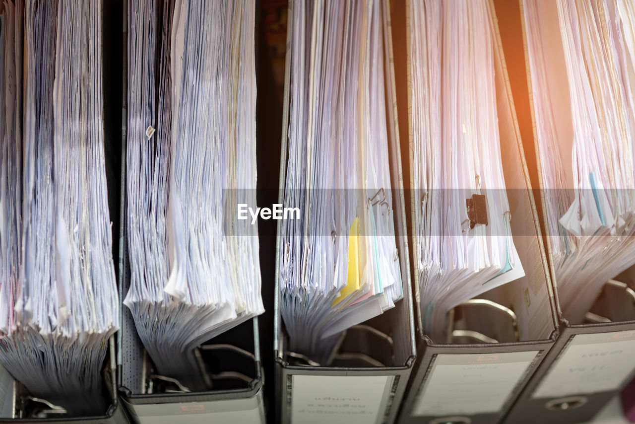 Full frame shot of documents in ring binders at office