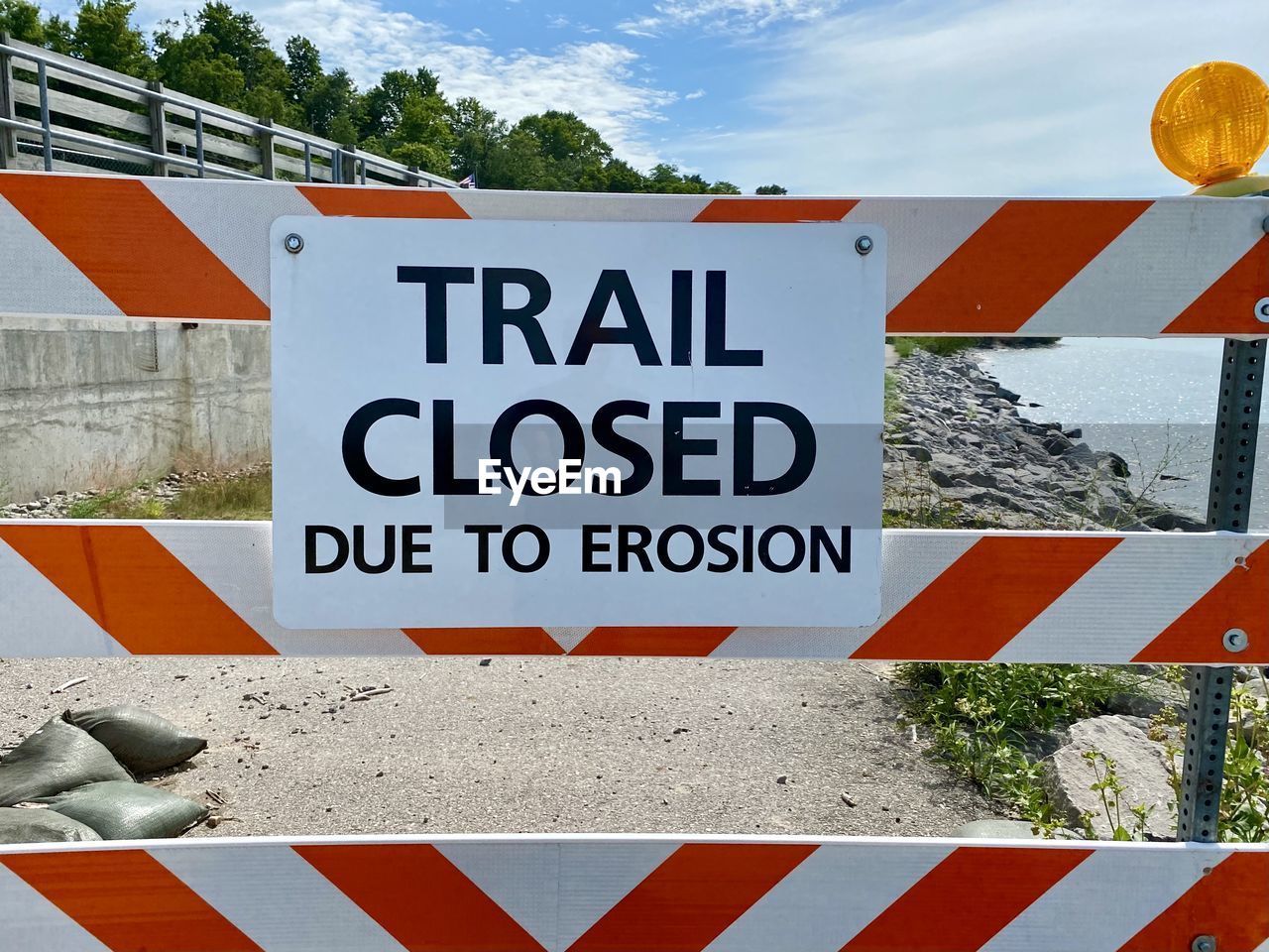 Close-up of closure sign on road