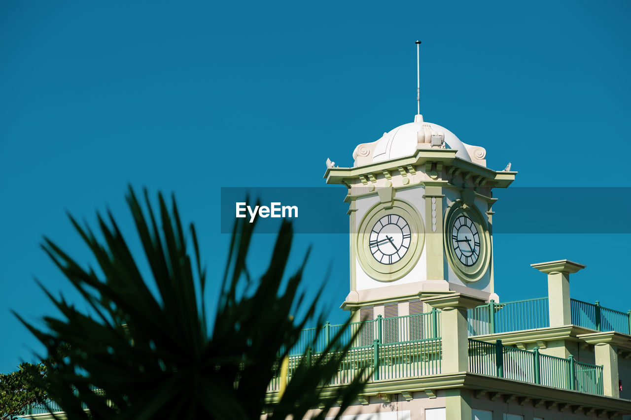 Low angle view of clock tower against sky