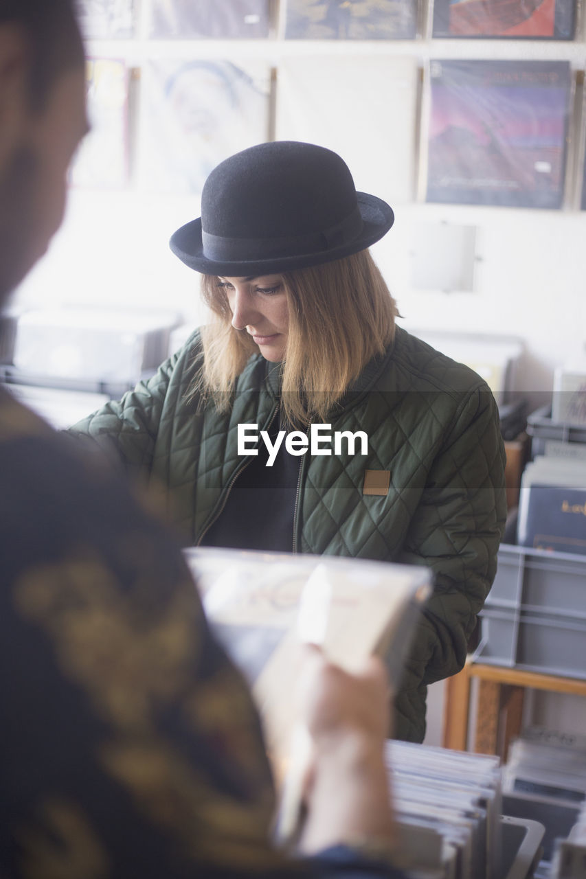 Young woman shopping for records