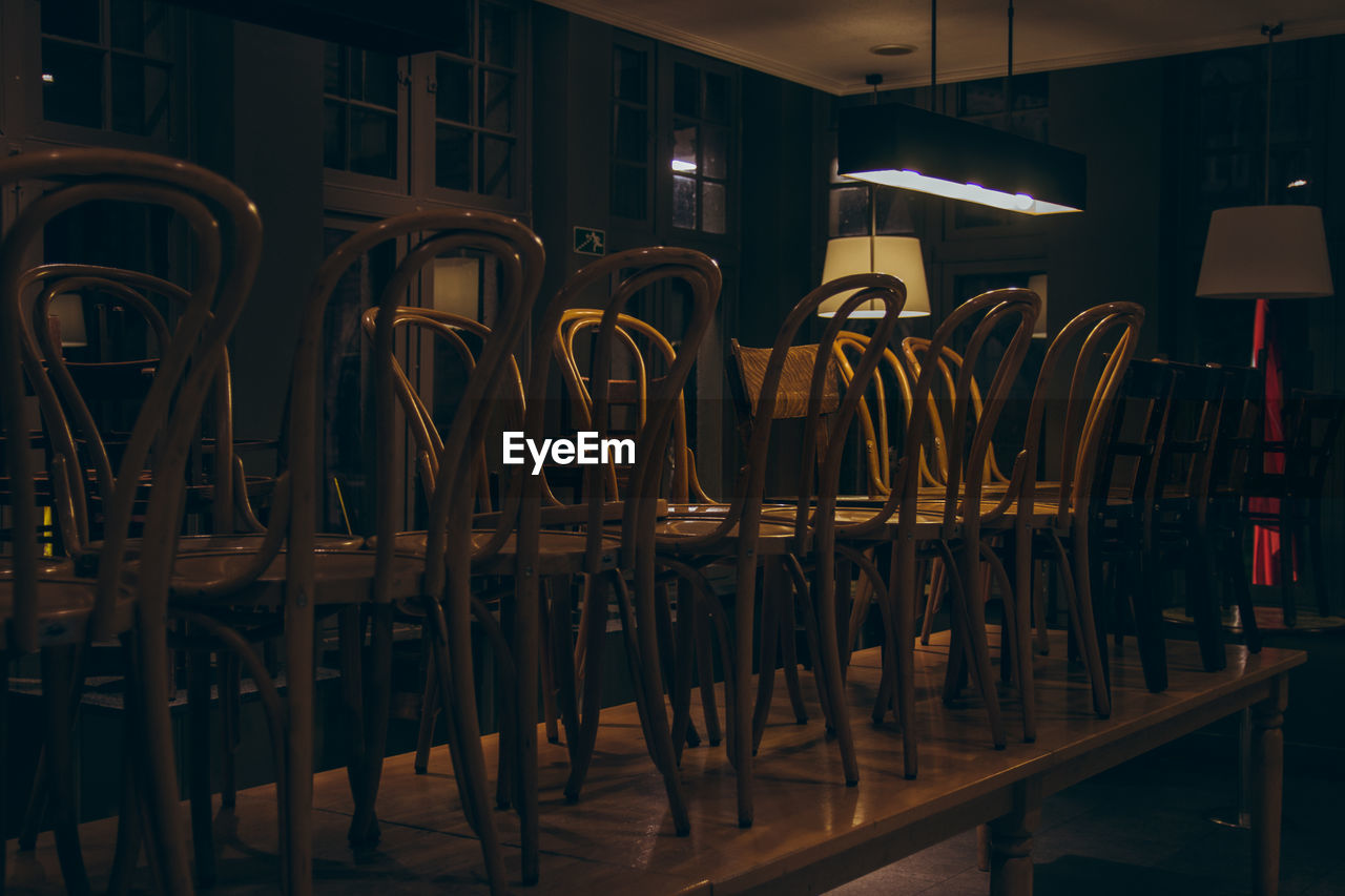 Empty chairs and tables in restaurant