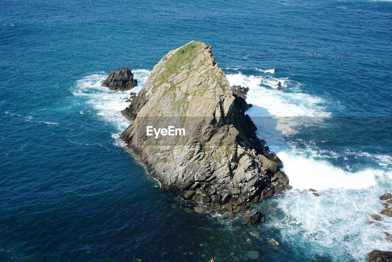 High angle view of rocks in sea