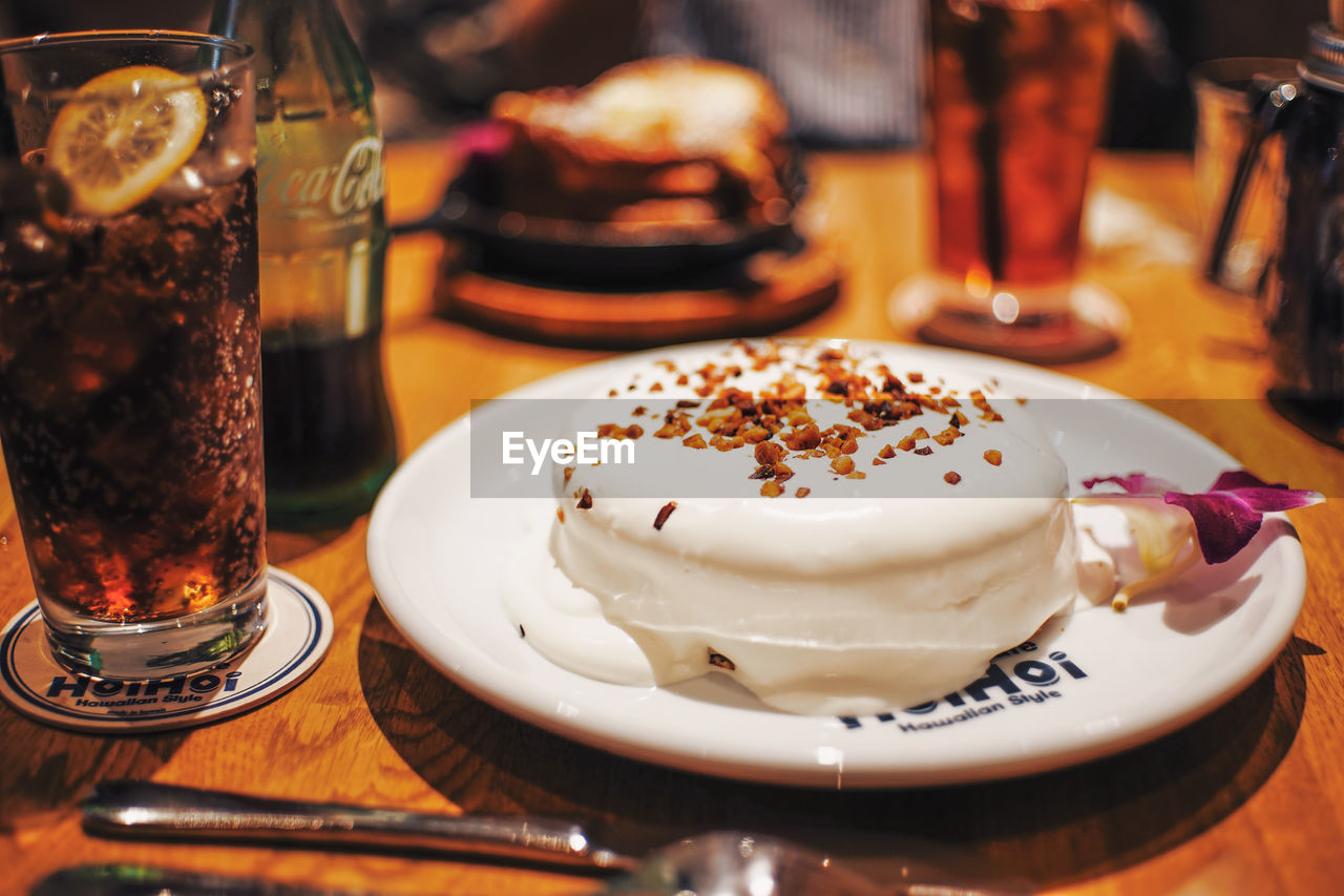 CLOSE-UP OF ICE CREAM WITH COFFEE ON TABLE