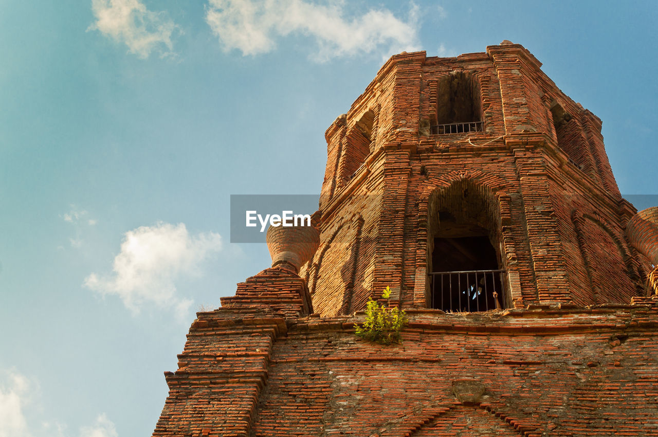 Low angle view of old building against sky