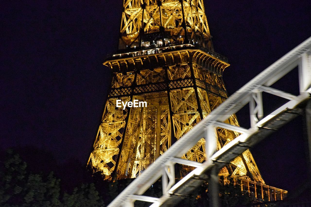 Low angle view of illuminated lit up eifel tower at night