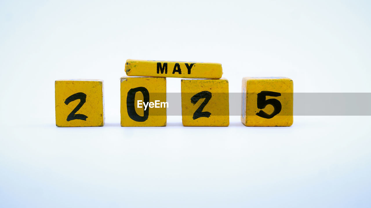 close-up of toy blocks with text on white background