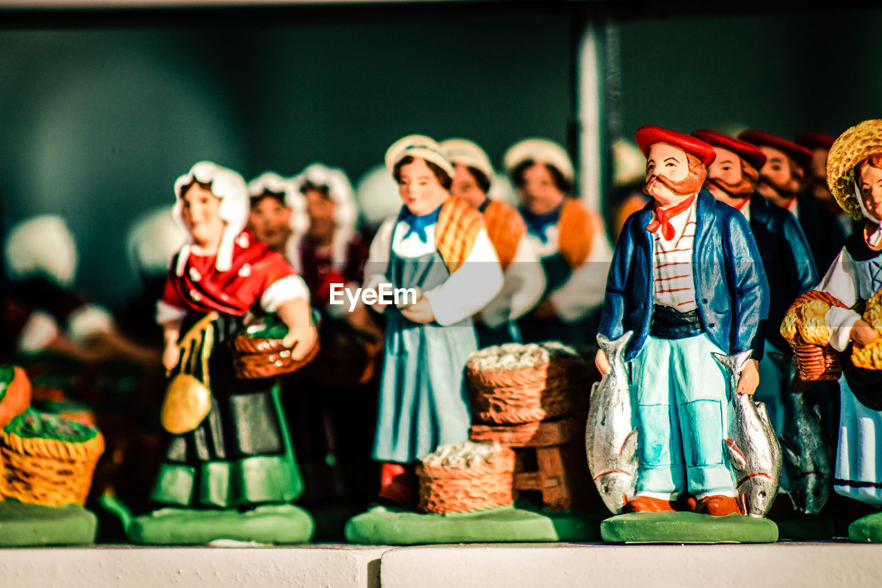 Close-up of figurines for sale at shop during christmas