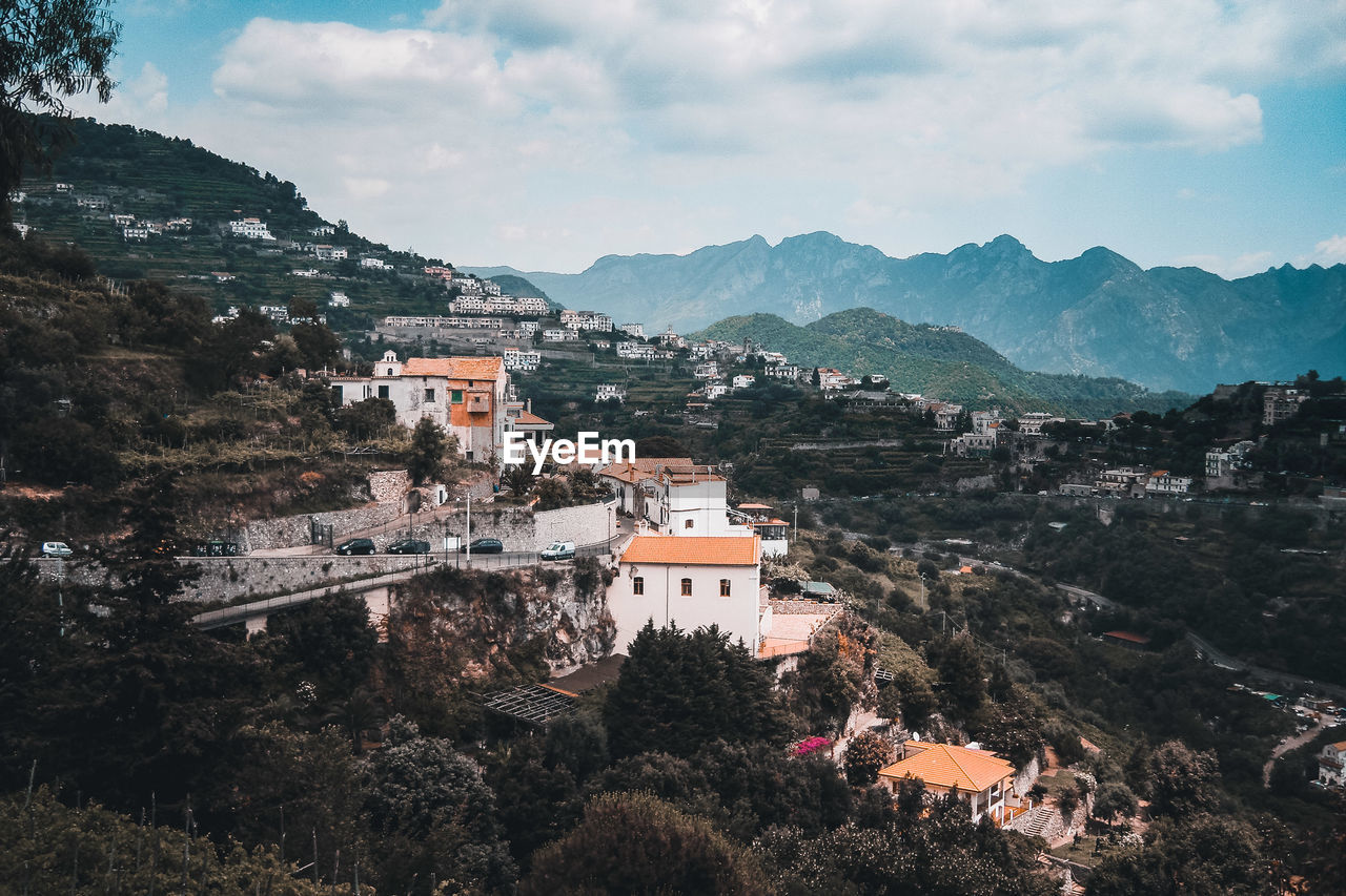 HIGH ANGLE VIEW OF TOWNSCAPE AND MOUNTAINS