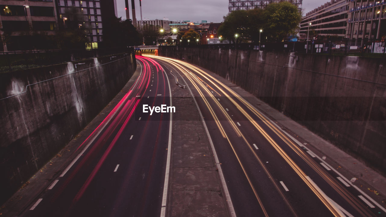 High angle view of light trails on road at night