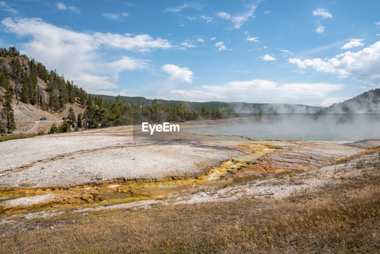 Scenic view of smoke emitting from midway geyser basin at yellowstone park