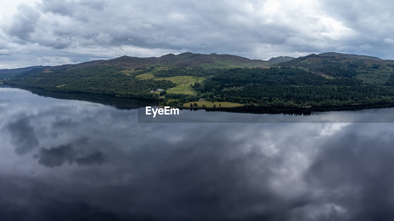 SCENIC VIEW OF MOUNTAIN AGAINST CLOUDY SKY