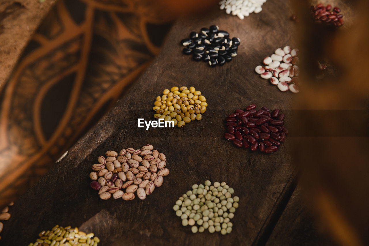 High angle view of ancient seeds on table