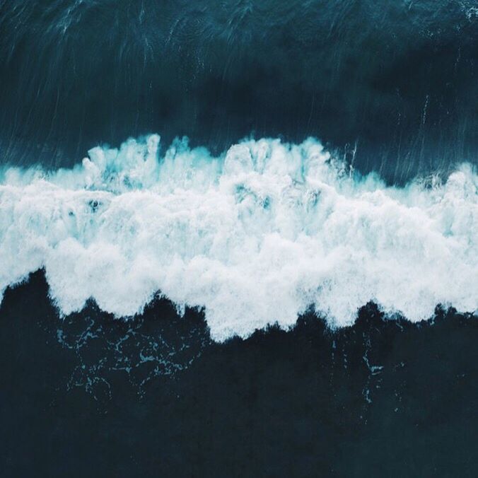 High angle view of wave rushing towards shore