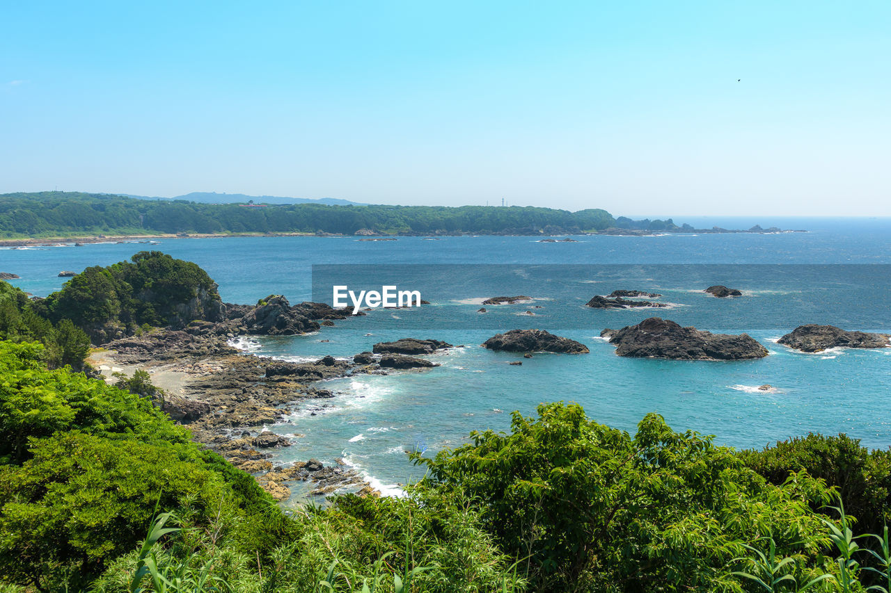 Scenic view of sea against clear blue sky