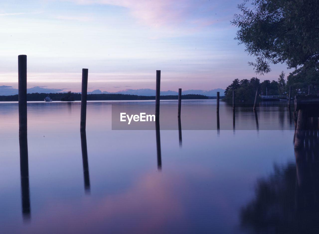 Scenic view of lake against sky during sunset