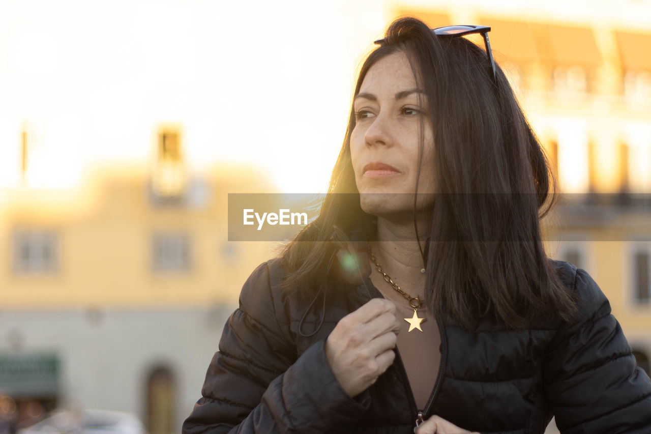 Portrait of mature woman smiling with unfocused background at florence, italy. 50mm lens