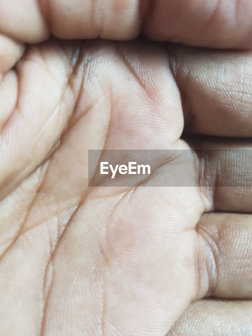 CLOSE-UP OF PERSON HAND WITH BABY