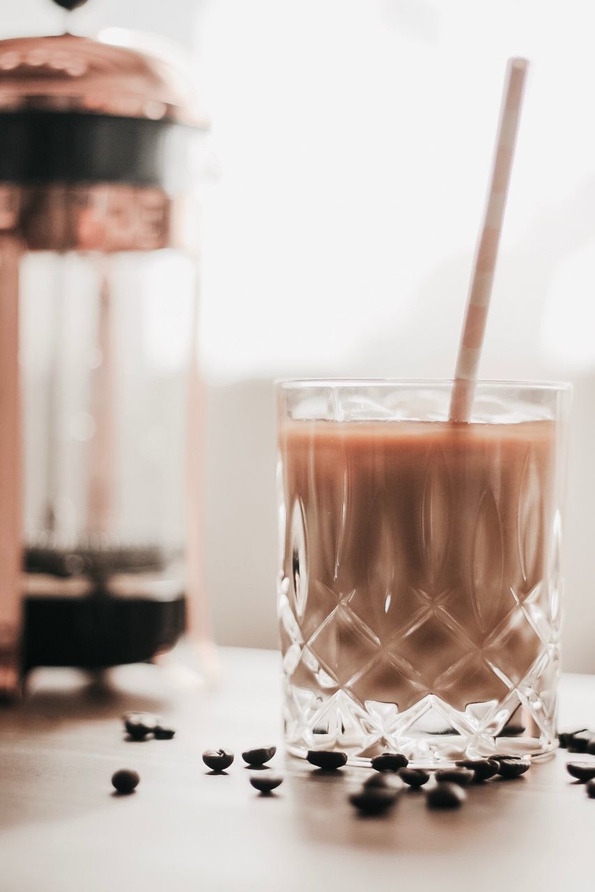 CLOSE-UP OF COFFEE IN GLASS