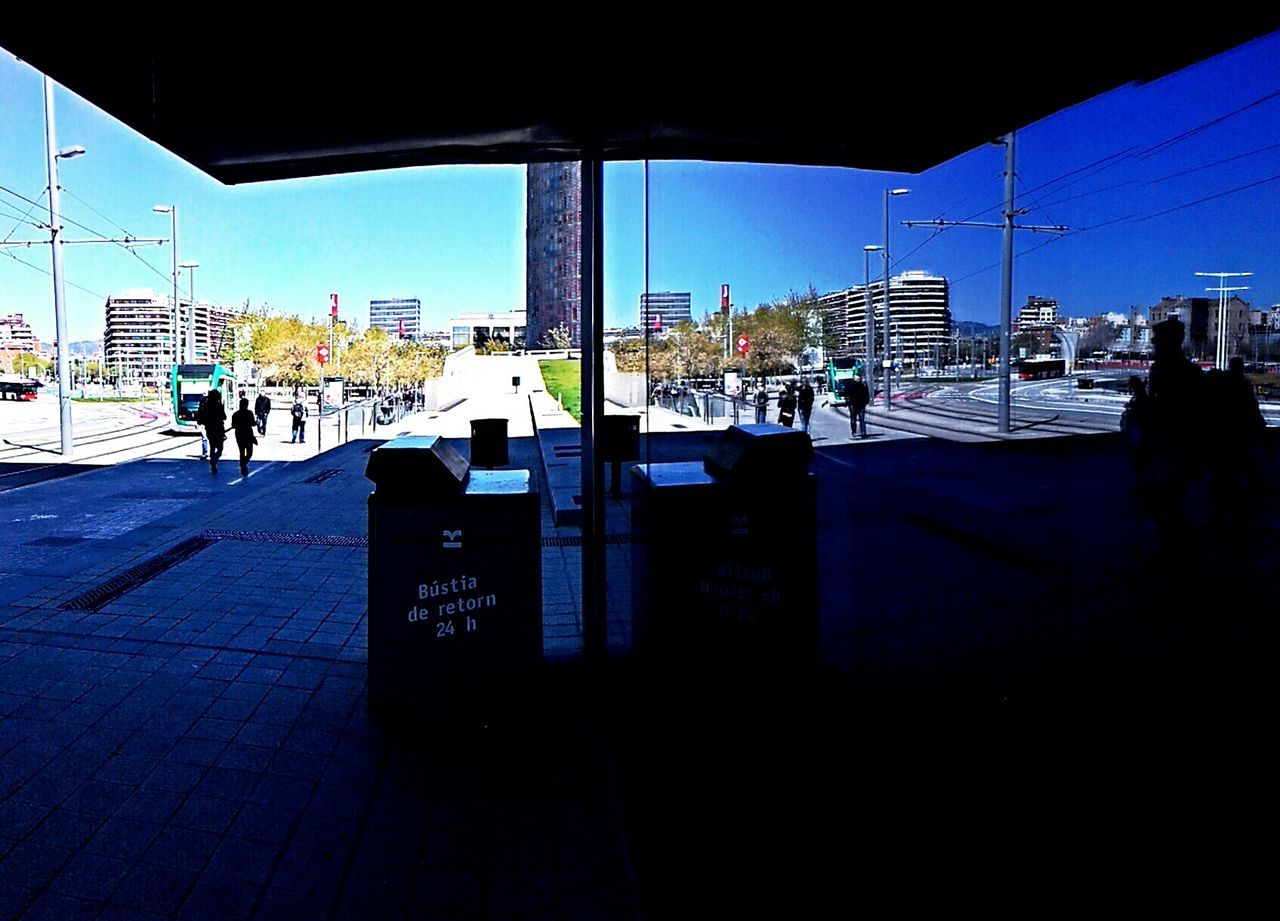 VIEW OF CITY STREET WITH BUILDINGS IN BACKGROUND