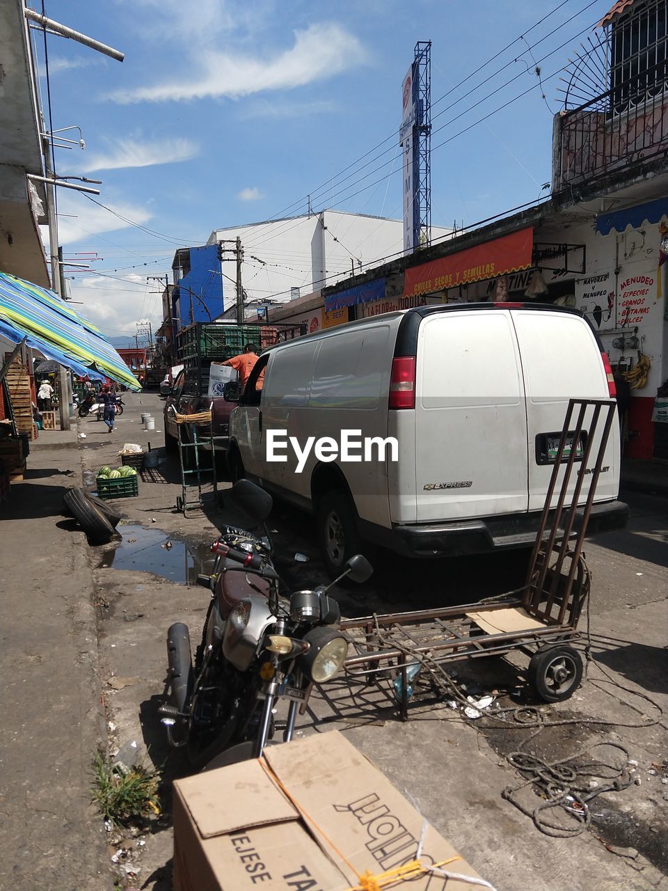 VEHICLES ON ROAD IN CITY