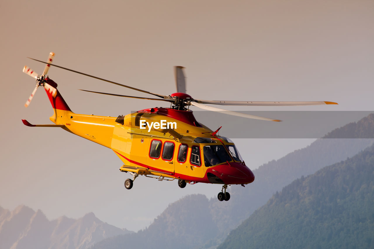 Helicopter flying against clear sky