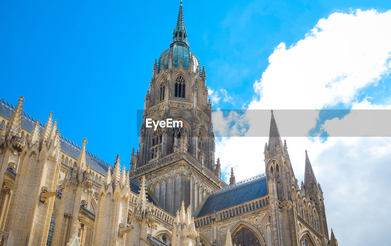 Low angle view of cathedral against cloudy sky