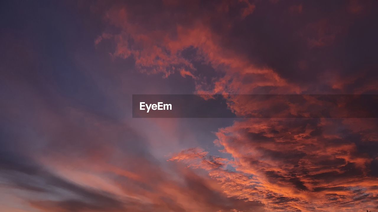 LOW ANGLE VIEW OF DRAMATIC SKY AT SUNSET