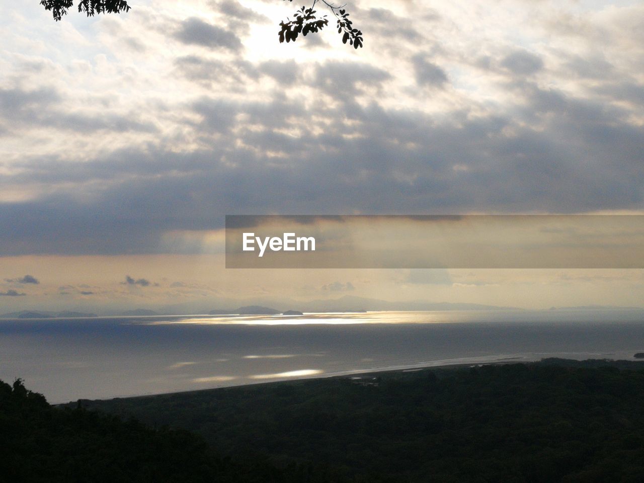 SCENIC VIEW OF SUNSET OVER SEA