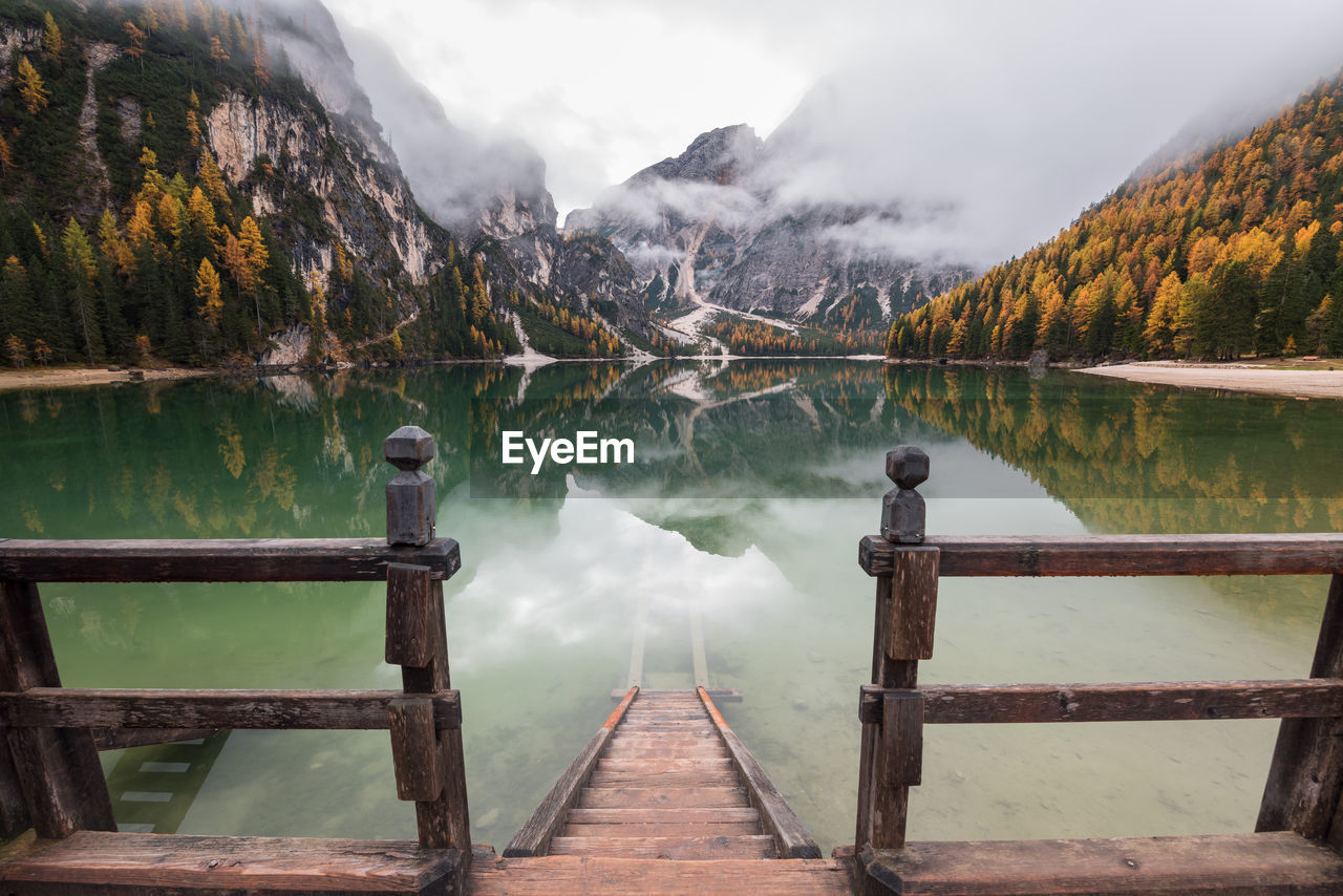 Pier over lake against sky