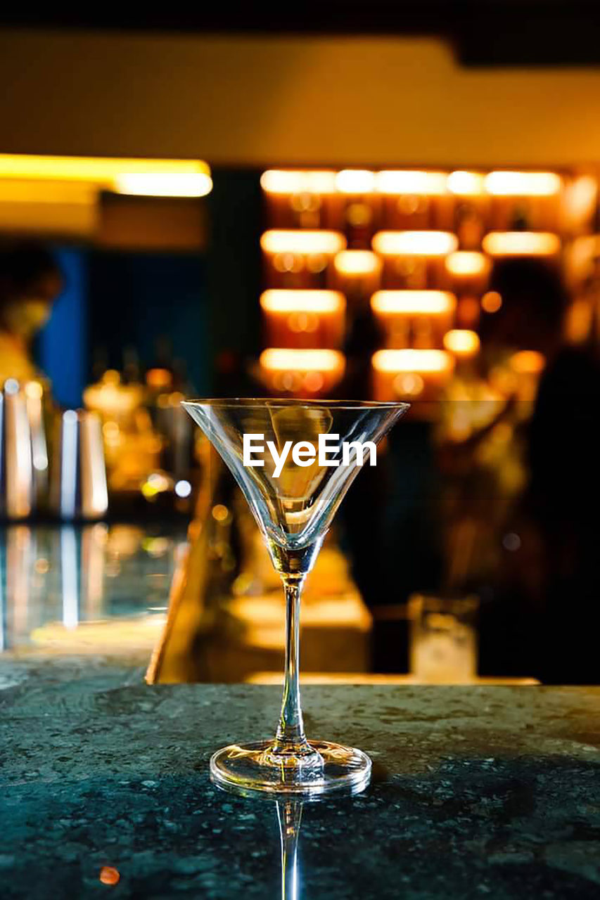 Close-up of wineglasses on table