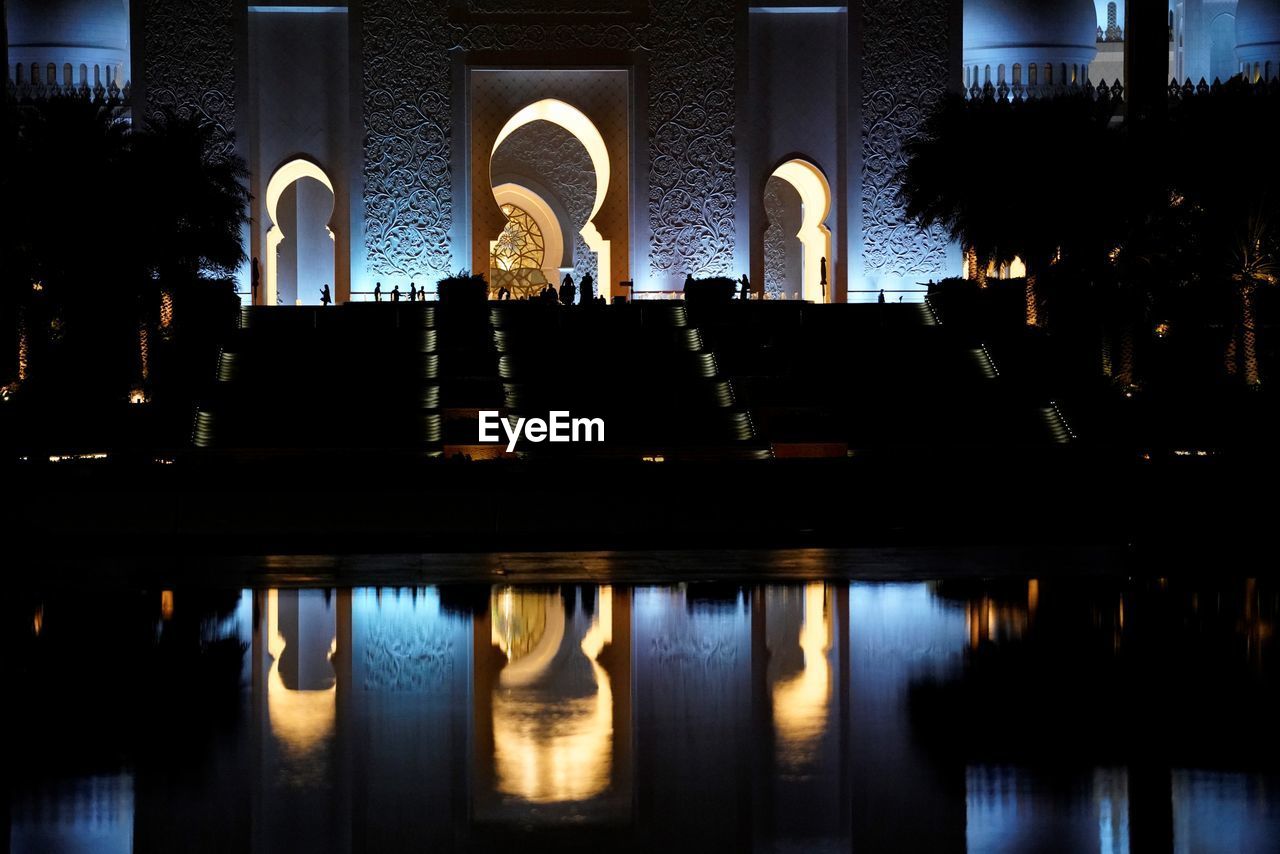 Night view on illuminated marble domes of grand mosque