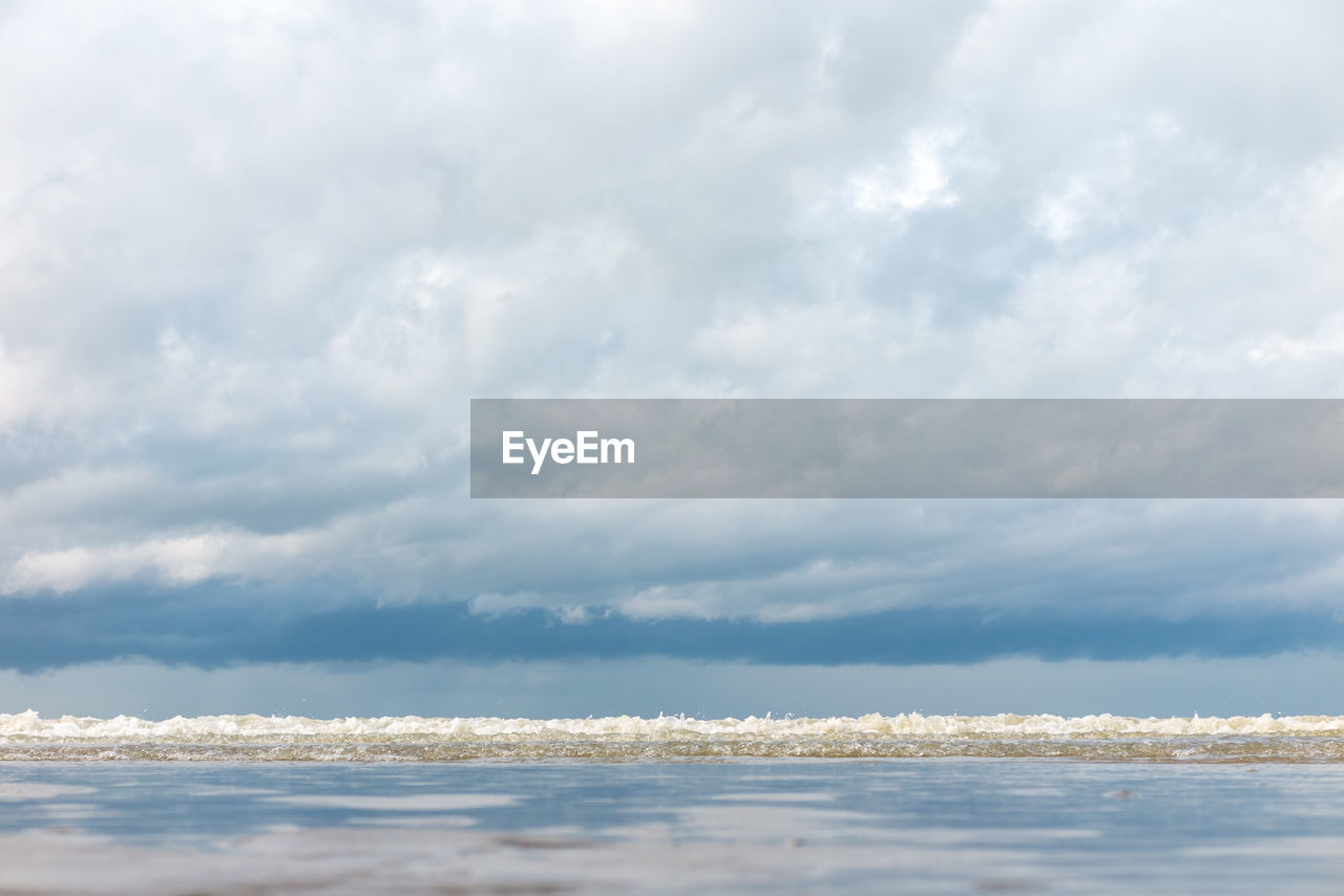 Scenic view of sea and cloudy sky