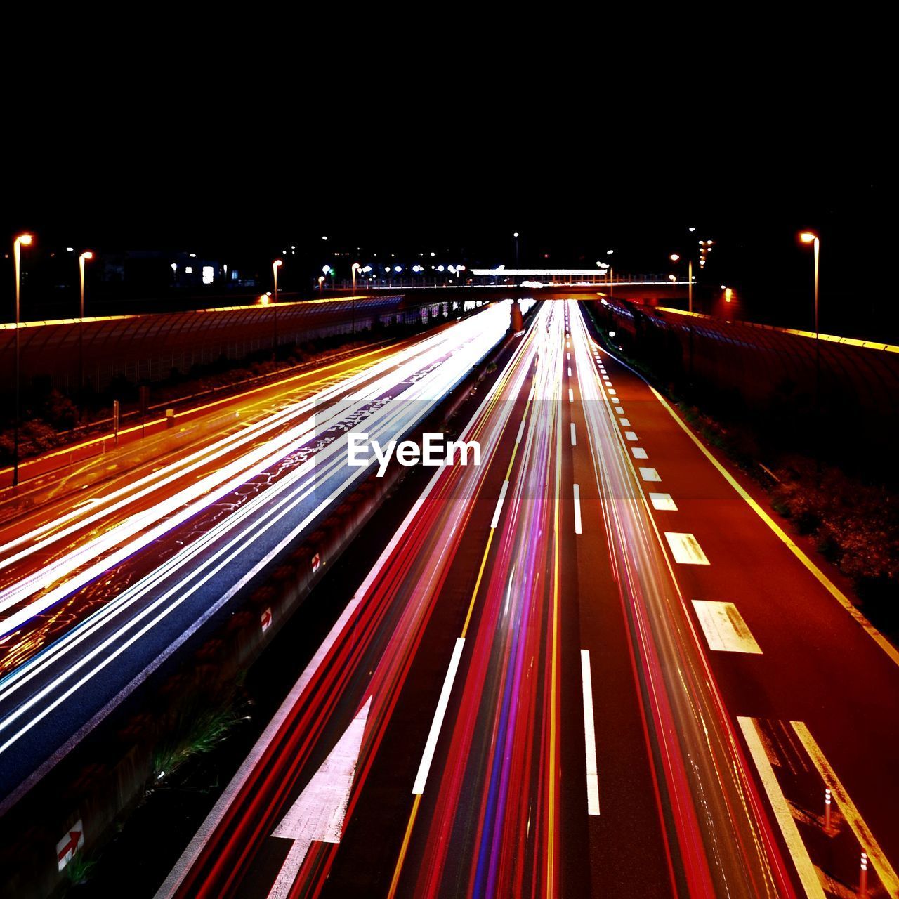 High angle view of light trails on road at night