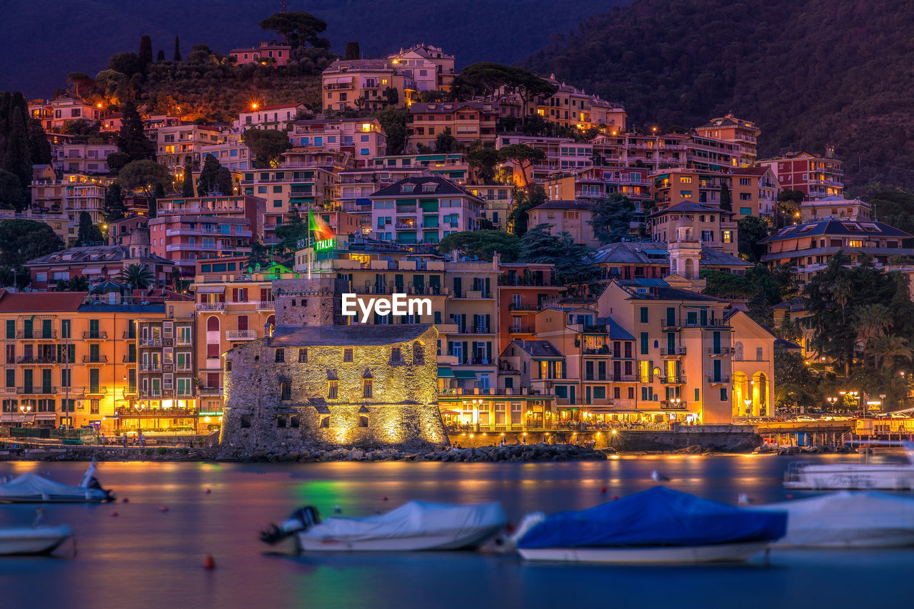 Panoramic view of rapallo town after sunset, liguria, italy