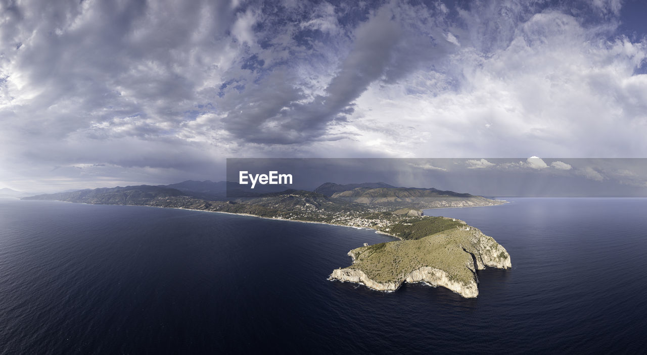 Aerial view of bay against sky