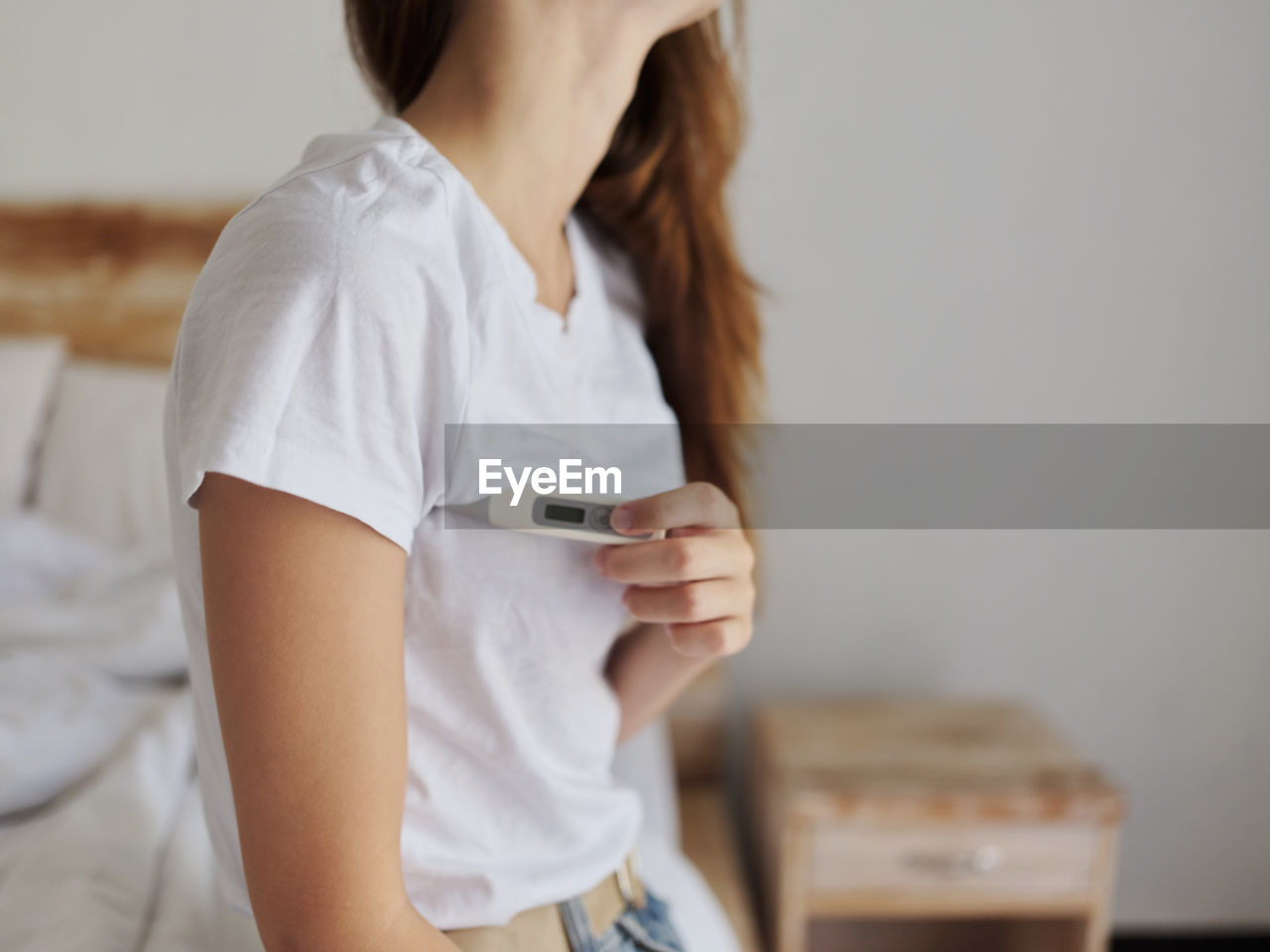 Midsection of woman using mobile phone