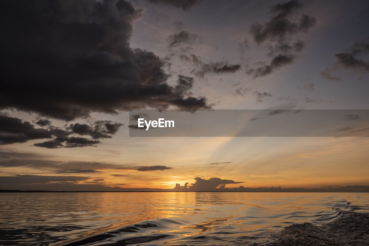 Beautiful colorful amazon sunset over the waters of negro river