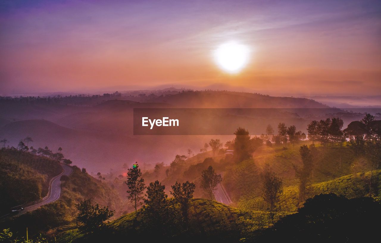 Scenic view of landscape against sky during sunset