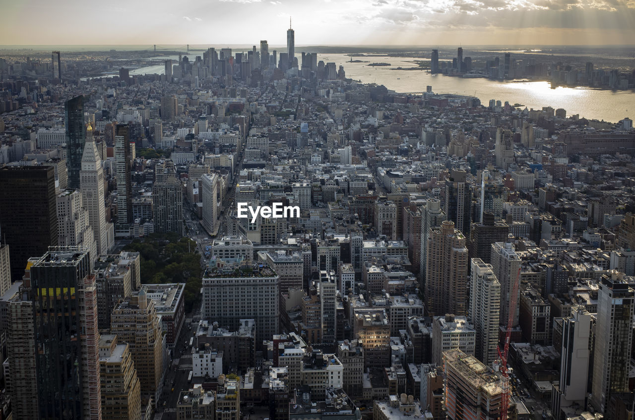 High angle view of city buildings against sky