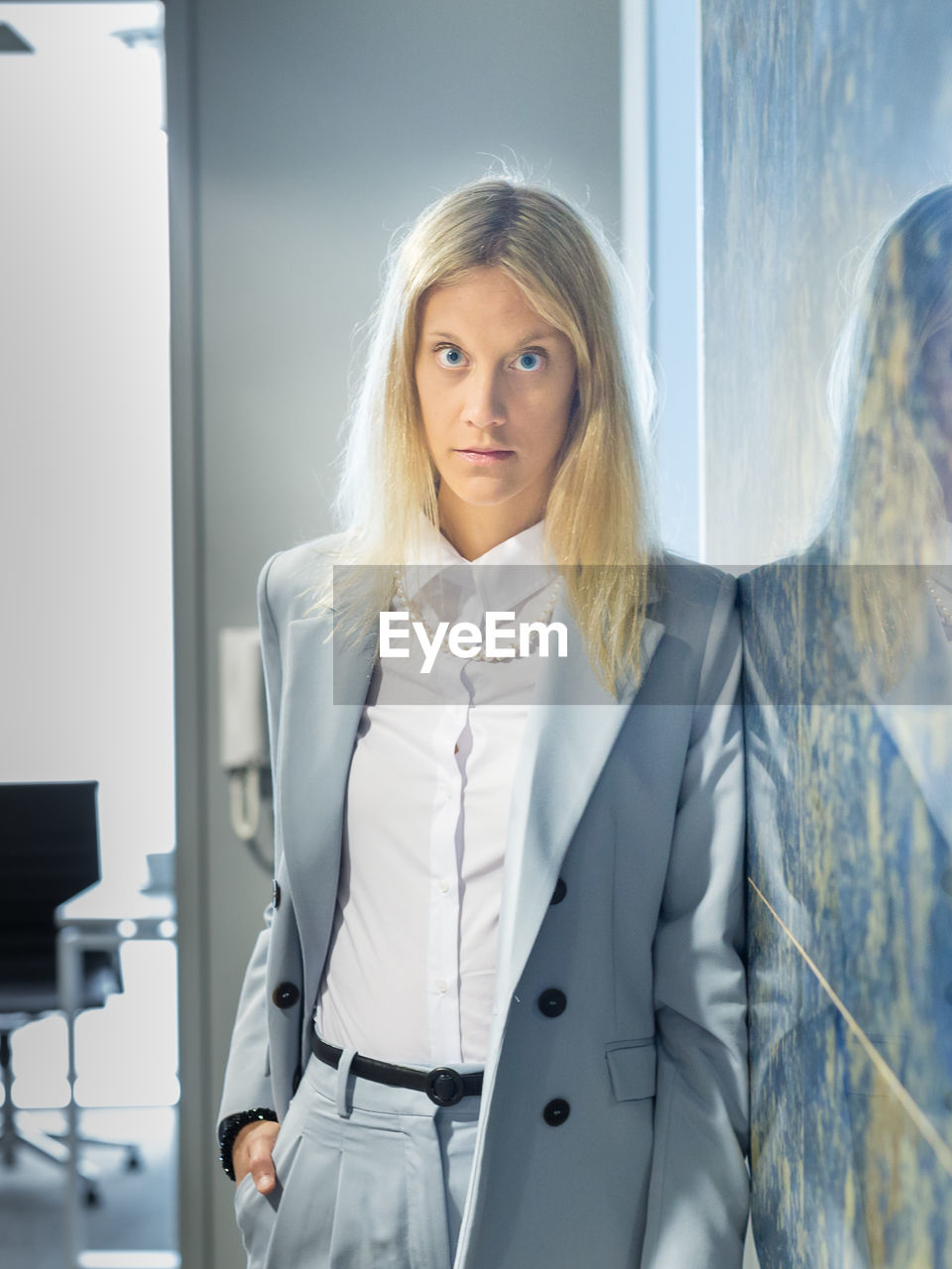 portrait of smiling businesswoman standing in office