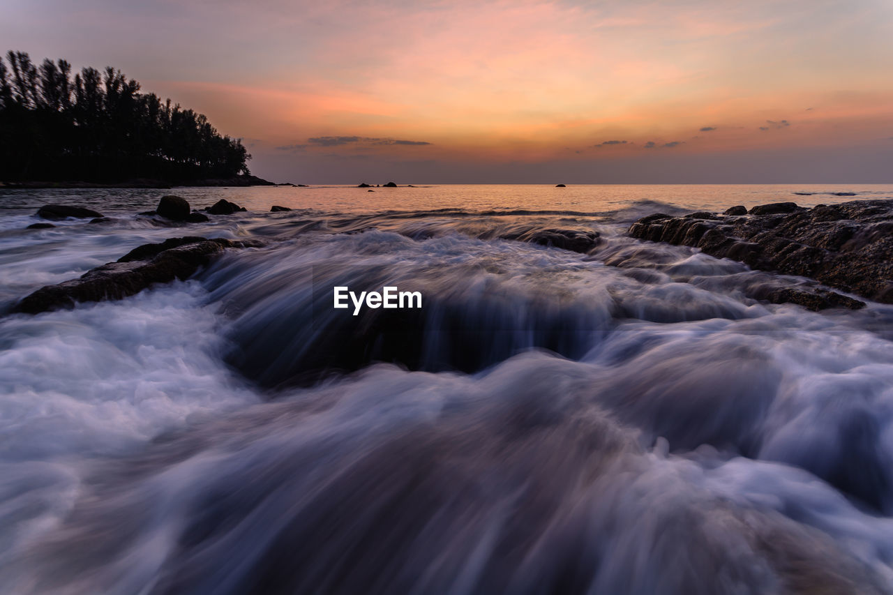 Scenic view of sea against sky during sunset