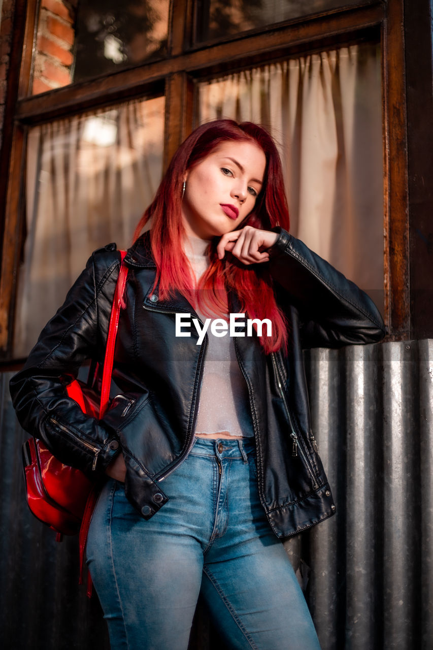 Red hair woman modeling. young beautiful woman with red hair wearing casual clothing.