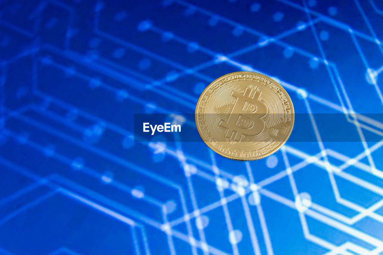 CLOSE-UP OF COINS ON THE BLUE METAL