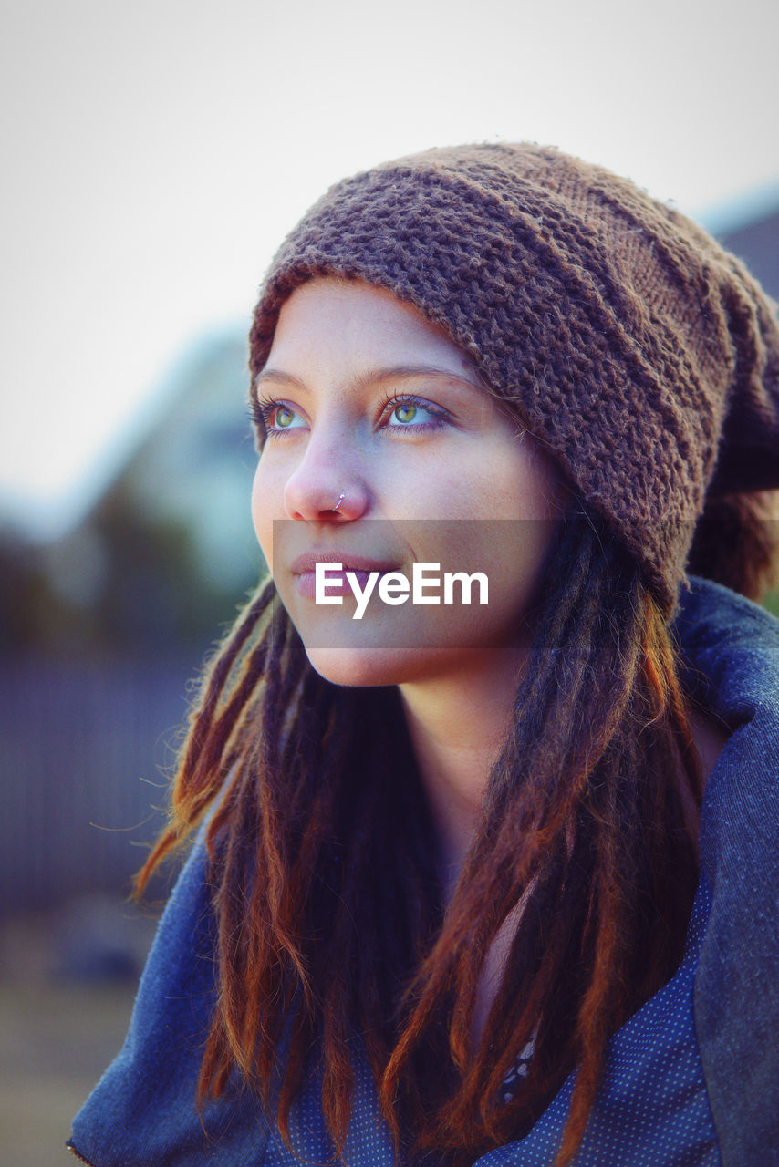 Close-up of young woman looking away