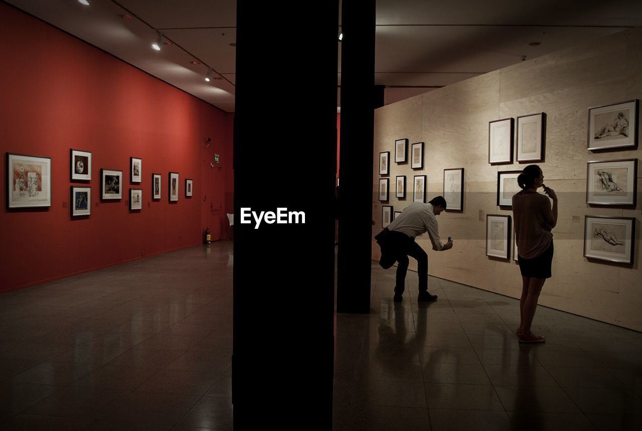 REAR VIEW OF A MAN IN CORRIDOR