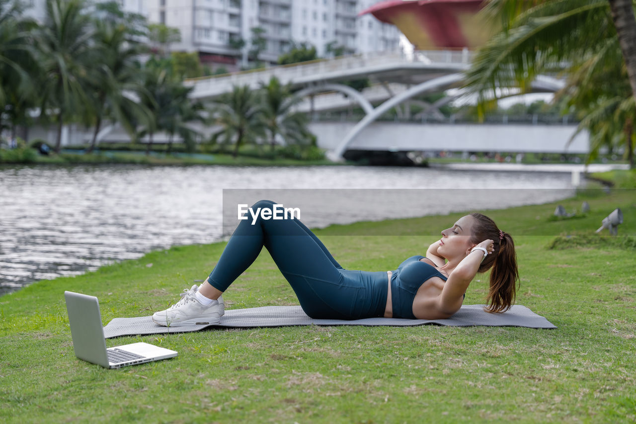 Woman lying on grass